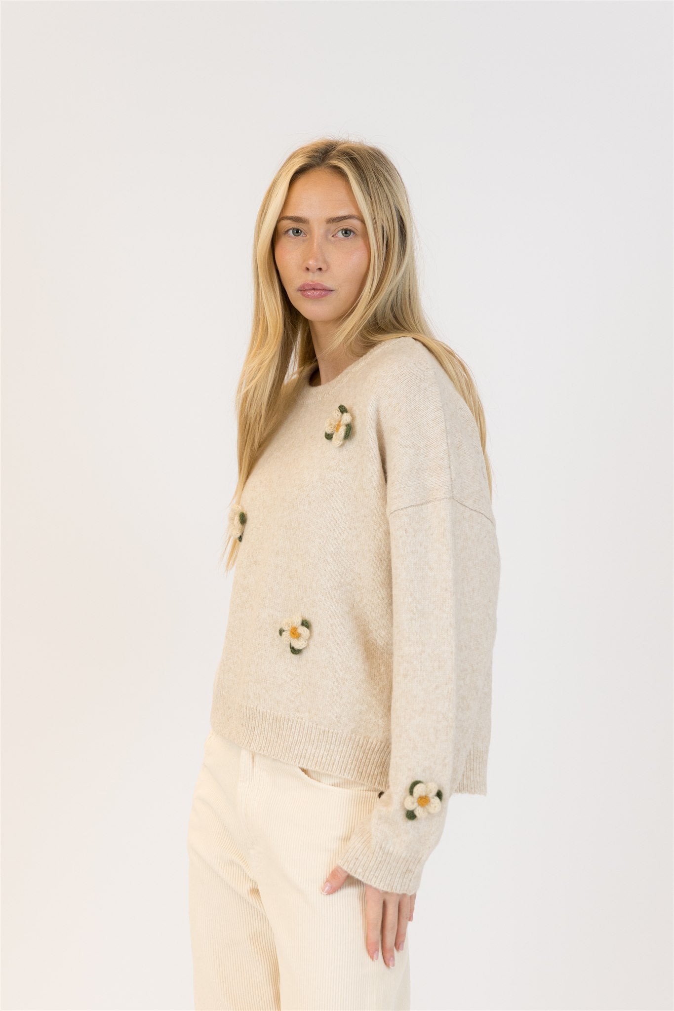 Pearls Boutique| Port Dover Ontario| Lyla +Lux| Holly Oat Crewneck Sweater. Lyla + Lux women’s crewneck pullover sweater crafted from a soft blend of polyester, acrylic, polyamide, and wool. Features intricate floral embroidery across the front, a classic crew neckline, and long sleeves. The lightweight yet cozy knit offers a relaxed, flattering fit, perfect for layering under outerwear or wearing on its own for a feminine, polished look.