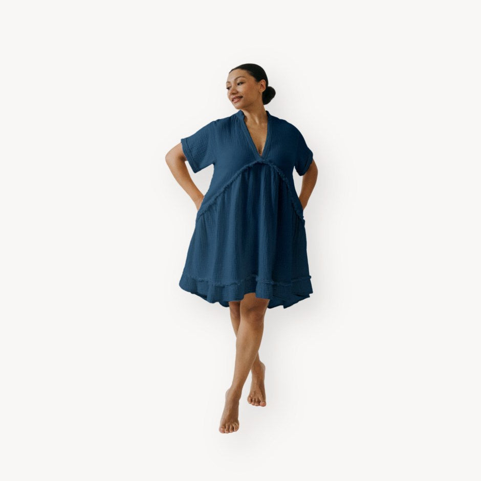 Woman wearing a blue dress on a white background, pearls boutique port dover, ontario