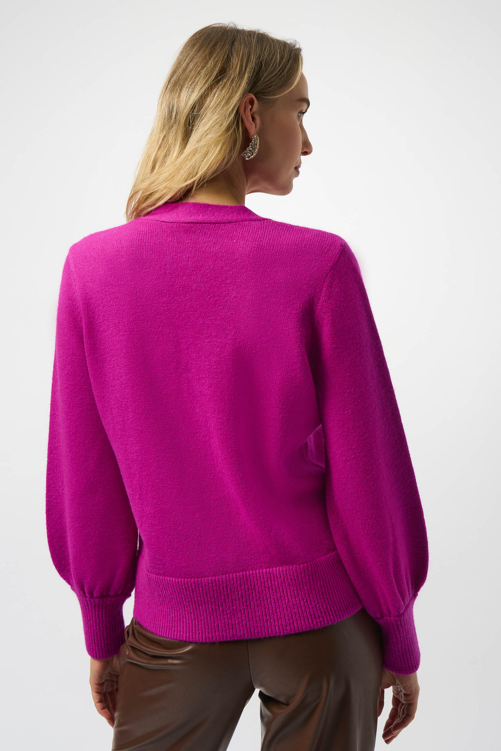 Person wearing a bright pink sweater on a white background, Port Dover, Ontario