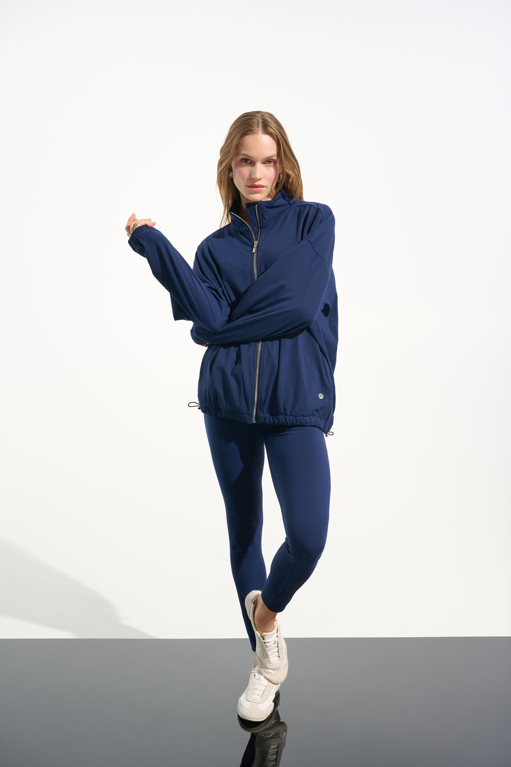 Indigo compression leggings and stretch jacket by Joseph RIbkoff, available at PEARLS Boutique, Port Dover, Ontario.