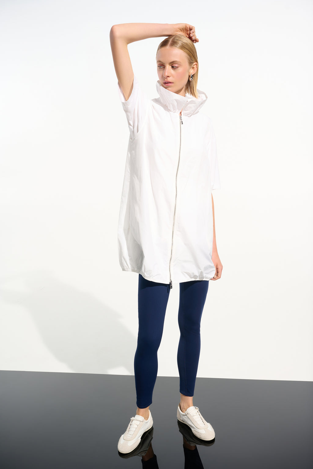 White nylon zip up sleeveless jacket by Joseph Ribkoff, available at Pearls Boutique in Port Dover, Ontario.