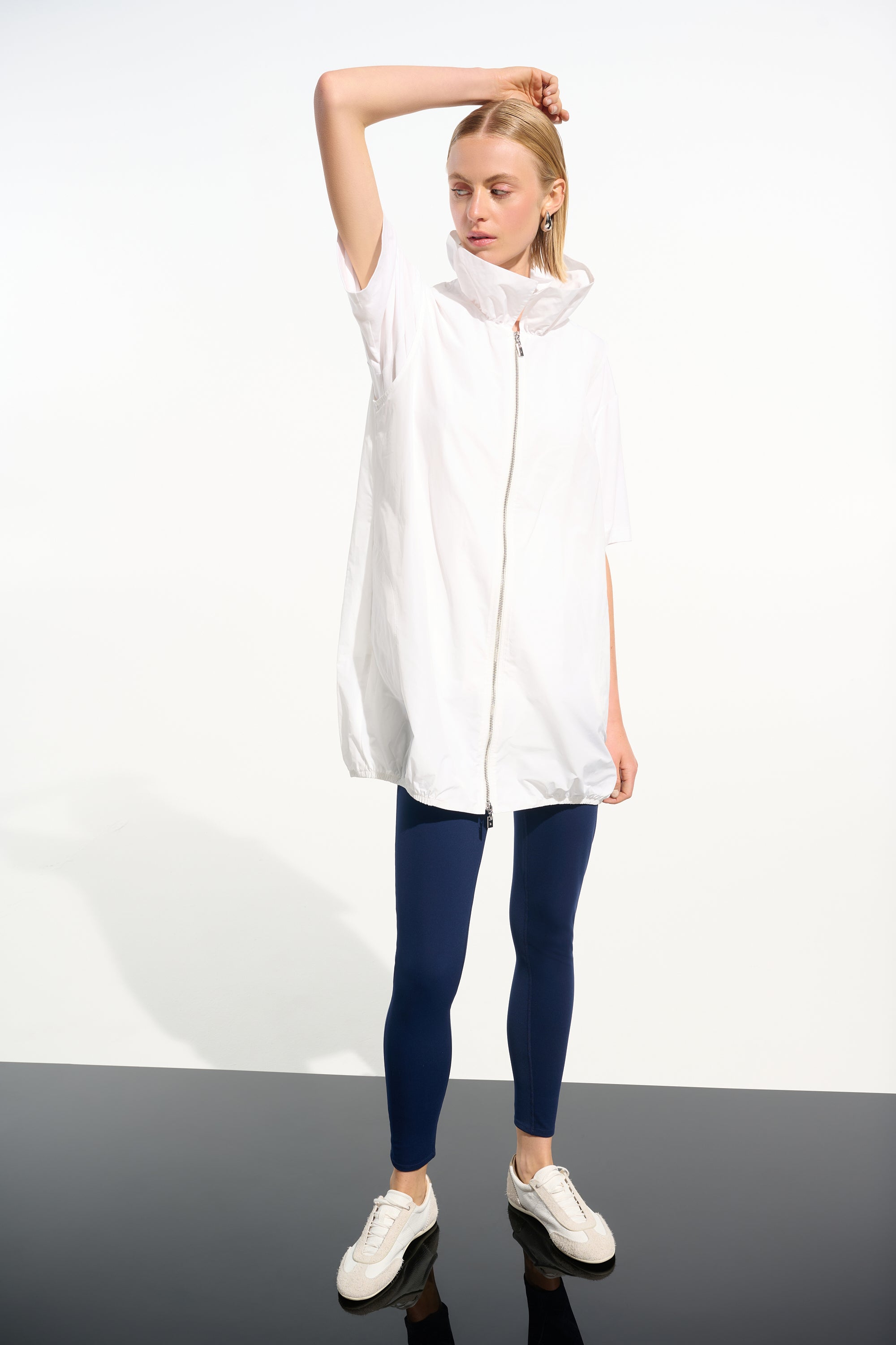 White nylon zip up sleeveless jacket by Joseph Ribkoff, available at Pearls Boutique in Port Dover, Ontario.