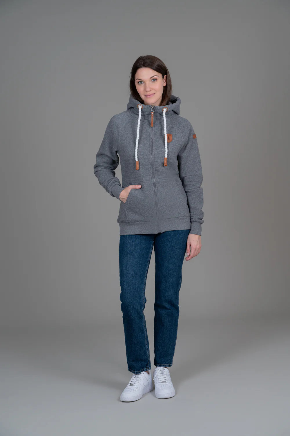 Pearls Boutique - Port Dover Ontario - Wanakome - Hera Heather Grey  - Hera Full-Zip Hoodie: our most popular and in-demand. Available in four stylish colors for a versatile wardrobe addition. Boasts a timeless design with a nautical touch. Perfect for adventure enthusiasts or chilly nights by the beach. Seamlessly combines style and comfort. Offers both warmth and fashion-forward appeal. Embrace the perfect blend of fashion and functionality with this essential.Pockets and full zip front