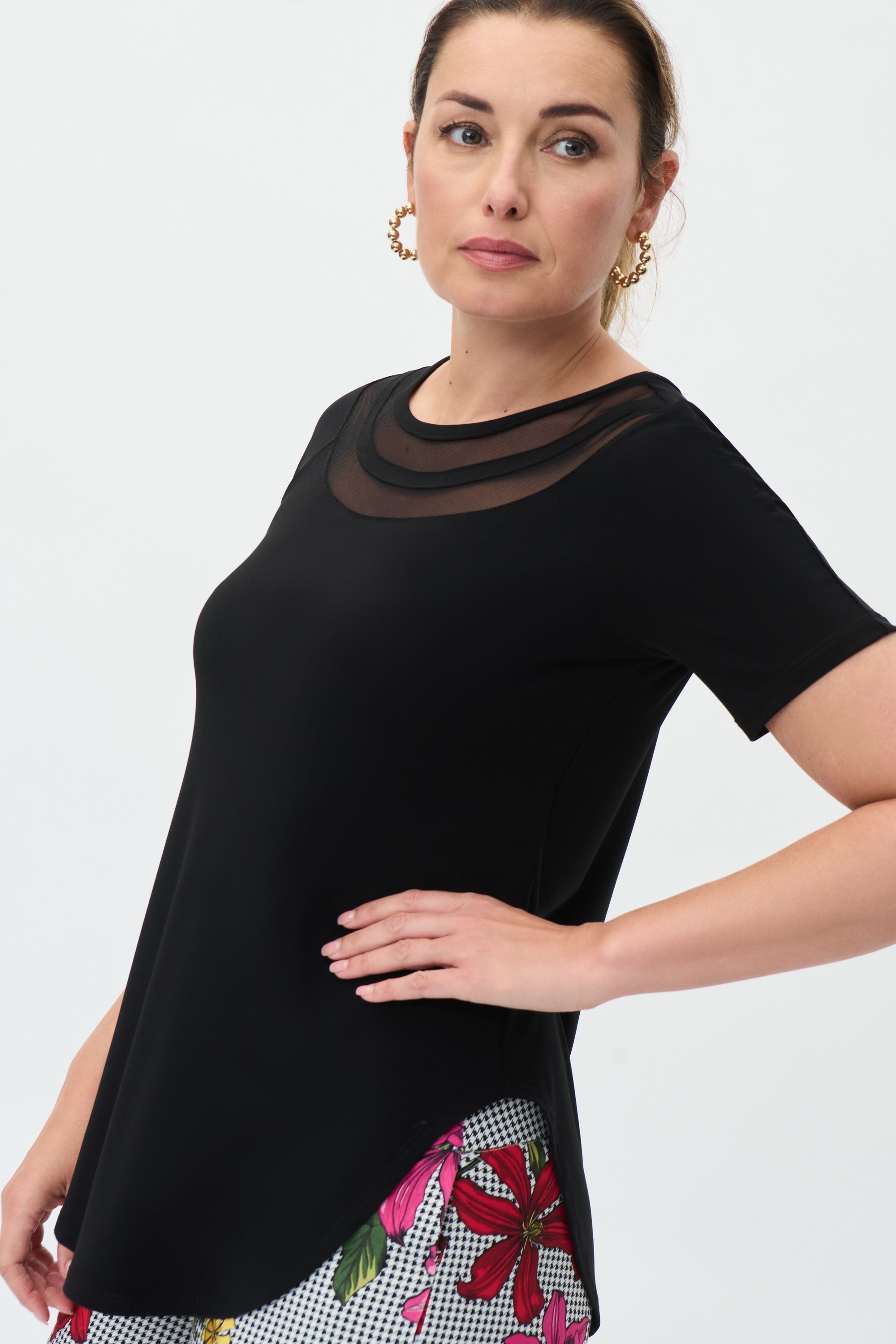 Pearls Boutique Port Dover Ontario - Joseph Ribkoff - Black Tunic. 222154. Classic Tunic With A Ribkoff Twist. Crew Neckline With Mesh Inlays. Shirt Style Hem. Light Weight Jersey Material