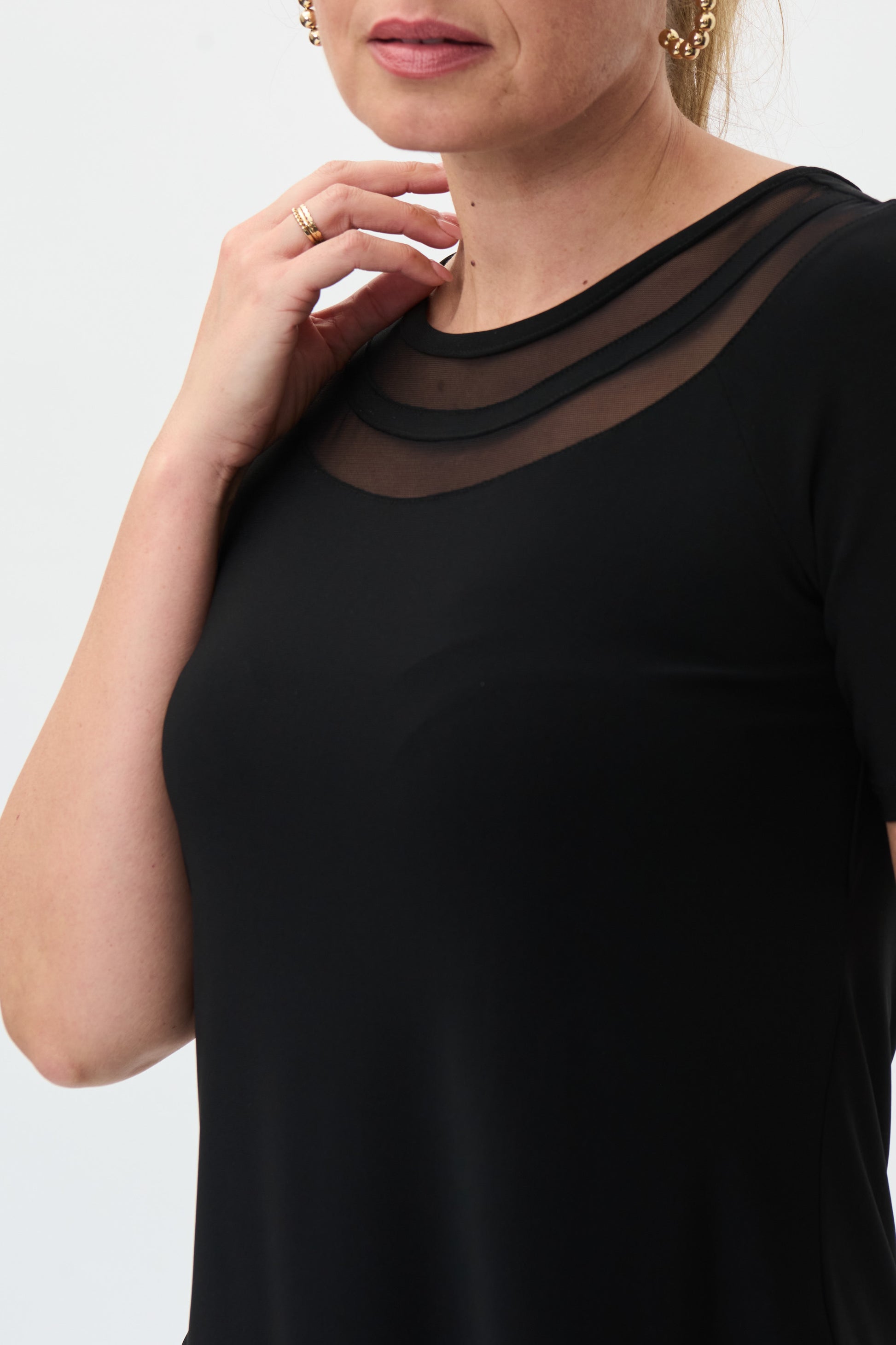 Pearls Boutique Port Dover Ontario - Joseph Ribkoff - Black Tunic. 222154. Classic Tunic With A Ribkoff Twist. Crew Neckline With Mesh Inlays. Shirt Style Hem. Light Weight Jersey Material
