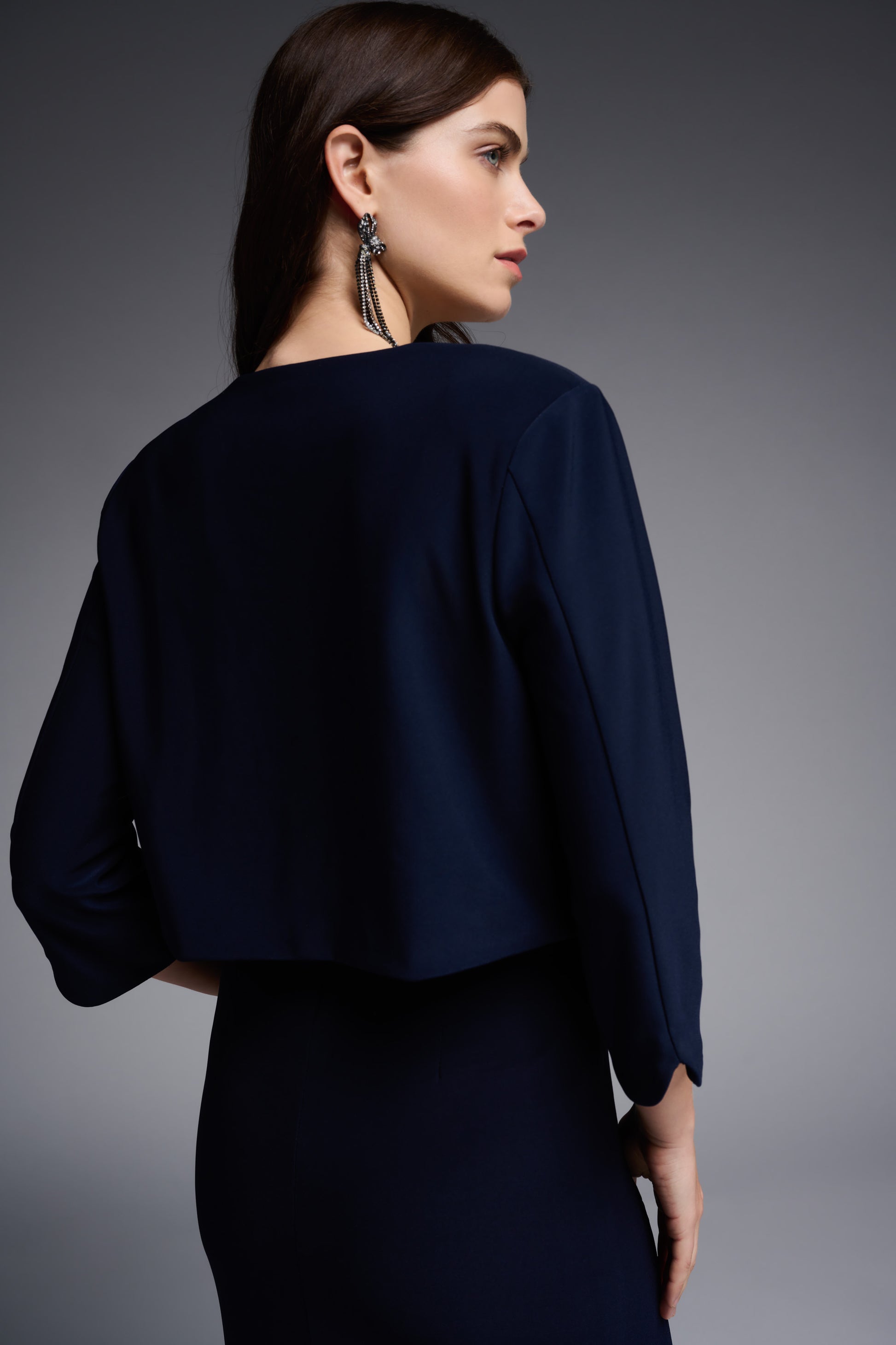 Pearls Boutique Port Dover Ontario - Joseph Ribkoff - Navy Bolero. Style 231736 Classic Midnight Blue Balero. 3/4 Length Sleeve With Scalloped Detailing. Curved Hemline. Open Front.